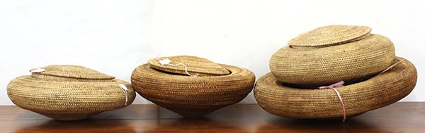 Indonesia coiled baskets: (lot of 4) Indonesian coiled baskets, possibly from central Lombok, each having a lid, and a squat form, largest: 19"dia. Provenance: Property sold to benefit the Phoebe A. Hearst Museum of Anthropolo