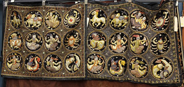Pair of Burmese kalaga wall hangings: Pair of Burmese kalaga wall hangings, executed in velvet and having embroidered, beaded, and sequined reserves depicting dancers and auspicious animals, larger 32"h x 41. Provenance: From the estate o