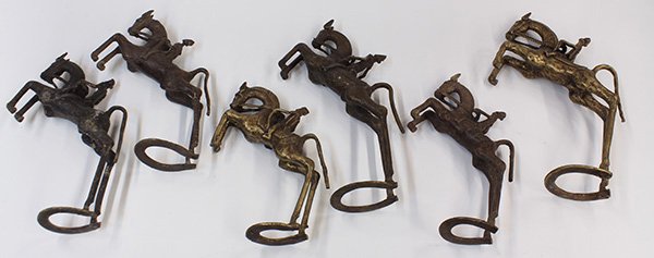 West African decorative brass sculptures: (lot of 6) West African decorative brass sculptures of rearing horses, largest: 13.5"h. Provenance: From the estate of Edward Gerber