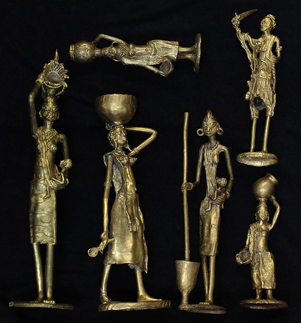 West African decorative brass sculptures: (lot of 6) West African decorative brass sculptures, depicting standing genre figures, largest: 15"l. Provenance: From the estate of Edward Gerber
