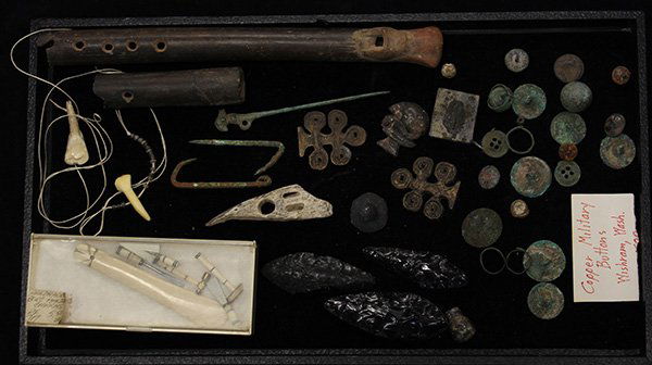 Associated group of miniatures: (lot of 38) Associated group of miniatures including a broken Pre-Columbian clay flute, ancient Pervuvian tweezers and cloak pins, obsidian arrowheads, bone artifacts and a group of copper military bu