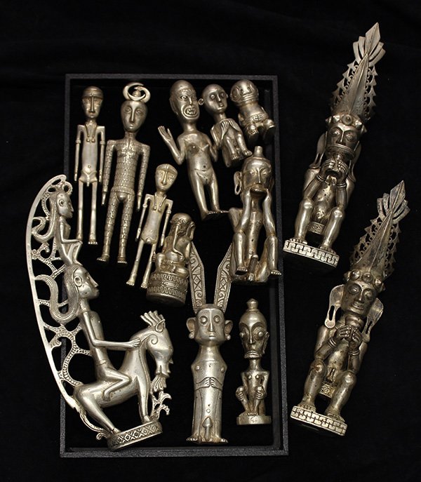 Toradya people style, Indonesia, decorative metal: (lot of 13) Toradya people style, Indonesia, decorative metal figures, including of some depicted seated, another on horseback; together with two wearing Nias style decoration, largest: 10"h. Provenan