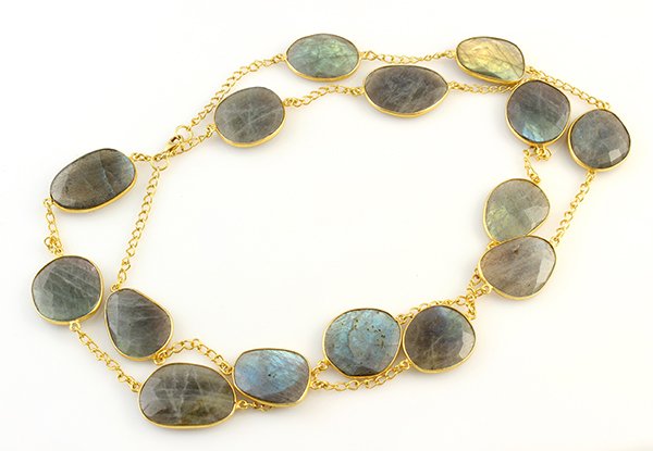 Labradorite and sterling silver gilt necklace: Labradorite and sterling silver gilt necklace composed of large labradorite rose cut plaques, bezel set in a link necklace, measuring 36", weighs 65.2 grams