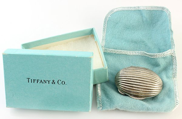 Tiffany & Co sterling silver pill box: Tiffany & Co sterling silver pill box oval design measures 2" x 1 1/2", weighs 30 grams, stamped Tiffany & Co sterling 925 Italy, complete with box and pouch