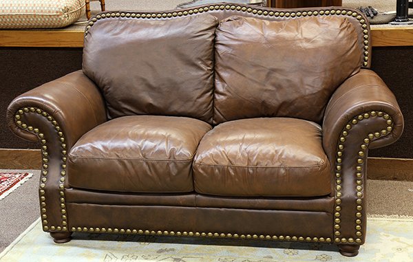 (lot of 4) Leather living room suite: (lot of 4) Leather living room suite, each with nail head trim comprising a love seat, 40"h x 67"l x 32"d, an armchair 40"h x 44"w x 32"d, with ottoman, 16"h x 23"dia., and a sofa, 40"h x 89"w x 32"d