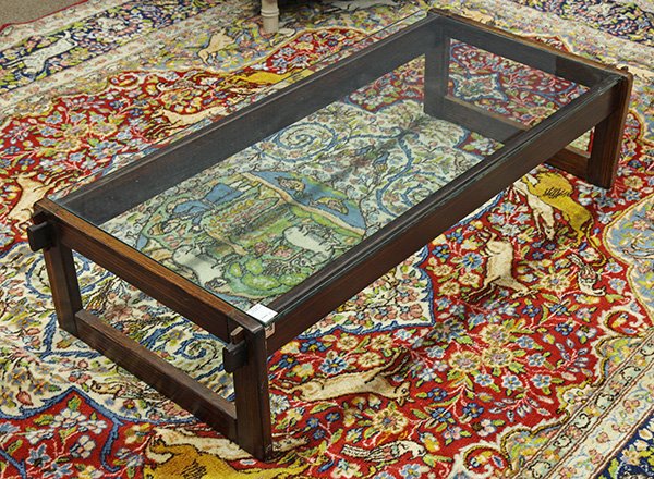Percival Lafer coffee table, having a rectangular glass: Percival Lafer coffee table, having a rectangular glass top, above a rosewood base having thru tenon construction, 12.5"h x 52"l x 23.5"d