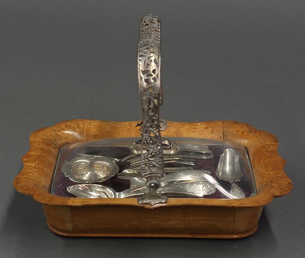 (Lot of 16) Dutch: (Lot of 16) Dutch .833 silver tea set, 1863, consisting of twelve spoons, sugar and tea shovels, each handled engraved with scrolling acanthus , the strainer mounted with a stick handle, all resting i