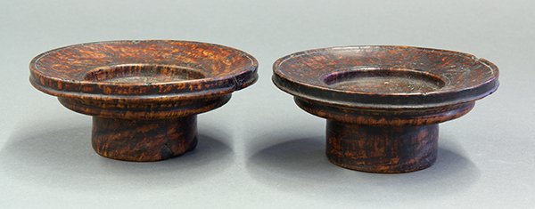 Himalayan Burlwood Footed Cup Stands: (lot of 2) Himalayan burlwood footed cup stands, with wide everted rim accented by raised bands, raised on a tall foot, 6"w. Provenance: From the estate of Edward Gerber