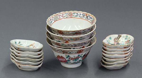 Group of Chinese Porcelain Cups/Sauce Dishes: (lot of 17) Chinese enameled porcelain cups and sauce dishes, late Qing/early Republic period, consisting of a set of four foliate rim cups decorated with flowers and the Eight Buddhist Treasures, the