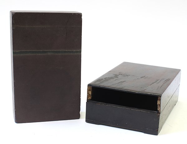 Chinese Inkstone Slab: Chinese inkstone slab, the rectangular block of a dark brown hue with light bands, with wood box, inkstone: 8"h x 5"w x 1.75"d. Provenance: From the estate of Edward Gerber