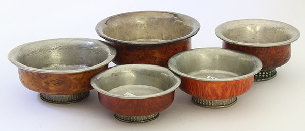 Five Himalayan Burlwood Bowls: (lot of 5) Himalayan burlwood and wooden bowls, each with silvered lining and with silvered band around the foot, largest: 4.5"w, Provenance: From the estate of Edward Gerber