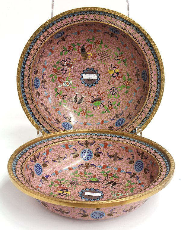 Chinese Cloisonne Pink Basins: Pair of Chinese cloisonne enameled pink ground basins, with Eight Buddhist Treasures centered by a lotus flower, all surrounded by 'fu' bats and 'shou' patterns, 14.5"w. Provenance: From the estate of