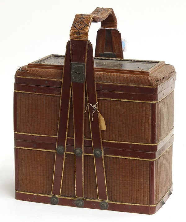 Chinese Food Basket: Chinese two tiered woven food basket, of rectangular form with lid with a gilt lacquered panel painted with crane and pines, 16.25"h. Provenance: From the estate of Edward Gerber