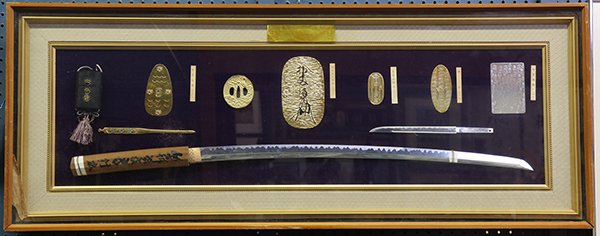 Framed Japanese Katana Model and Koban: Framed Japanese katana and other katana furniture - kozuka, kogai, and tsuba - reproductions, and replica of five various gold and silver coins from 12th century to 17th century, including Tensho gold