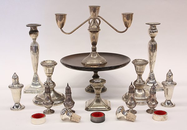 (lot of 18) American sterling silver weighted items,: (lot of 18) American sterling silver weighted items, including a wood dessert stand, three-light candelabra, two pairs of candle holders, napkin rings, salt and pepper shakers