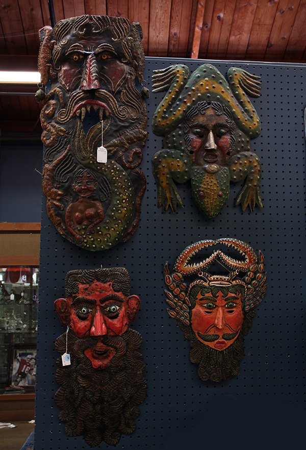 (lot of 4) Mexican polychrome decorated tin dance masks: (lot of 4) Mexican polychrome decorated tin dance masks, each depicting a mythical figure with a human face, one with downward gazing eyes, another with reptilian arms and legs, another with claw arms