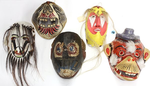 (lot of 5) One shelf of Mexican masks: (lot of 5) One shelf of Mexican masks, executed in wood, metal, and papier mache consisting of; a Guatemalan monkey mask executed in carved wood with a central eye hole and painted blue eyes on a blac