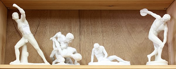 (lot of 6) Group of figural sculptures: (lot of 6) Group of figural sculptures, each depicting Classical style nudes, including one throwing a discus, another of a pair of wrestlers, a third in an athletic pose, and the last a fallen warrio