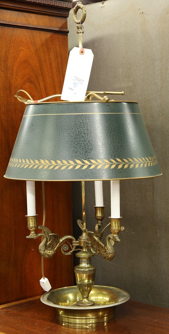 Bronze and partial gilt bouillotte table lamp: Bronze and partial gilt bouillotte table lamp, having a green metal shade with gilt embellishment surmounting three figural swan form arms rising above the urn form standard, the whole resting on turn
