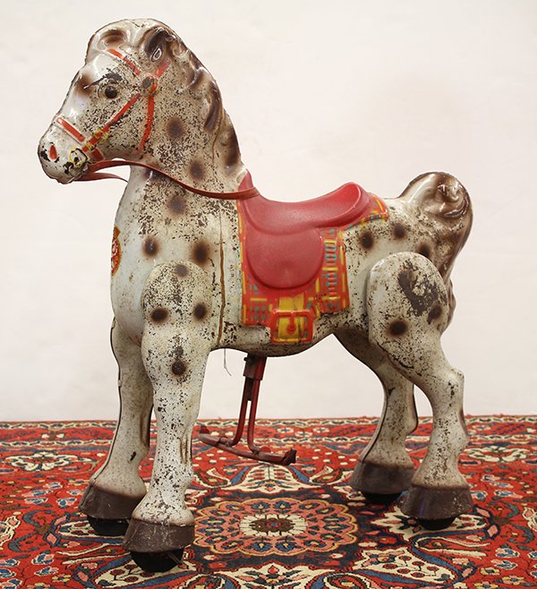 Vintage Mobo polychrome decorated metal mechanical: Vintage Mobo polychrome decorated metal mechanical riding horse, executed in brown and white, and having a red saddle, 30"h x 26"w x 7"d