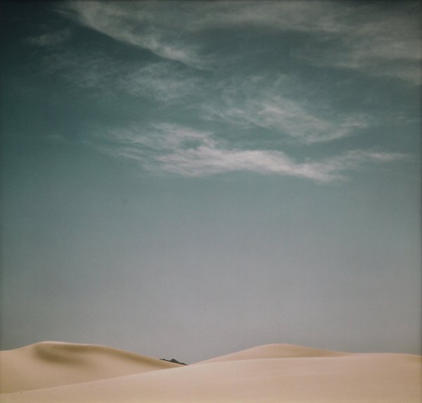 Photographs, Neil Folberg: (lot of 2) Neil Folberg (American, b. 1950), "Great Dune & Cloud, Sinai" (1980) / "Monastery of St.George, Judea" (1983), cibachrome prints, mat signed and dated in pencil lower right, signed, titled 
