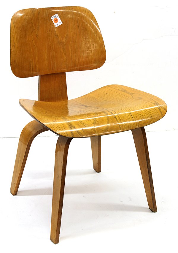 Early Charles and Ray Eames DCW chair for Knoll: Early Charles and Ray Eames DCW chair for Knoll, circa 1947, executed in molded plywood, having a curved back and seat and rising on tapering legs, retains the early 'Evans Products Company Molded Ply