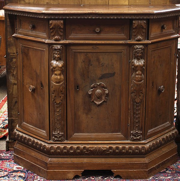 Continental Renaissance style chest: Continental Renaissance style chest, circa 1820, the hexagonal top above three drawers, surmounting three doors flanked with caryatid supports, and rising on a molded base, 41.5"h x 46"w x 18"d