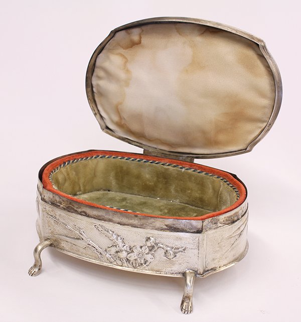 Chinese Export silver footed jewelry/trinket box, by: Chinese Export silver footed jewelry/trinket box, by Zee Shun, the shaped vessel having a finely hammered ground decorated with cherry blossoms, mounted with a hinged cover, and raised on figural supp