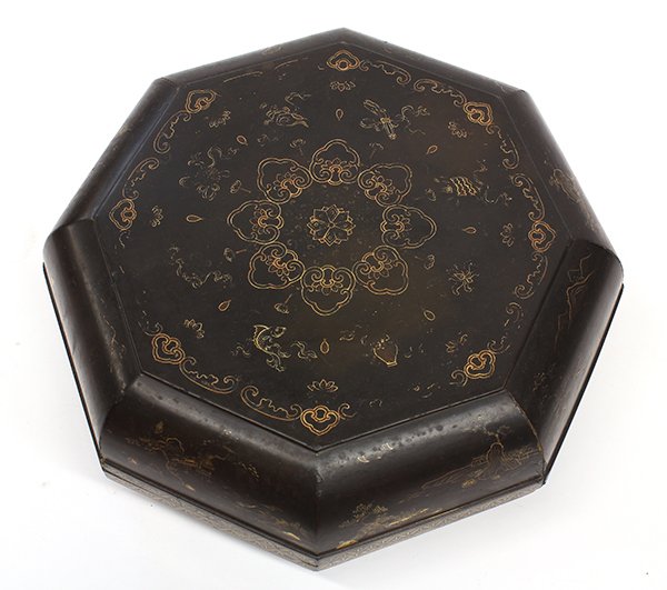 Chinese Gilt Lacquer Box, 18th c: Chinese gilt lacquer octagonal box, 18th century, the lid centered with a medallion composed of ruyi heads encircled by Buddhist Treasures, the side of the lid and box with riverside landscapes, the i