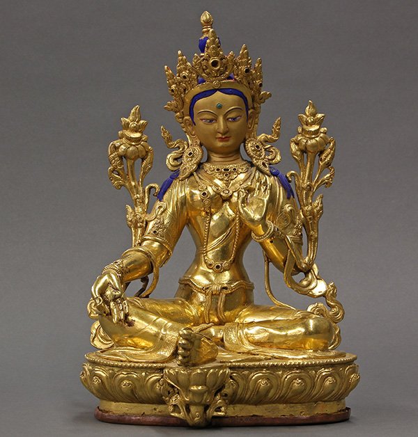 Himalayan Bronze Tara: Himalayan gilt bronze Tara, seated in royal ease on a lotus throne, and holding two lotus sprigs, 12"h. Provenance: From the estate of Edward Gerber