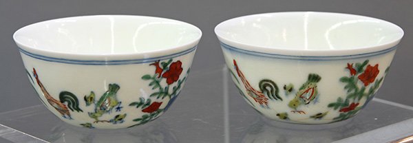 Chinese Doucai Chicken Cups: (lot of 2) Chinese doucai porcelain cups, with roosters, hens and chicks among flowers and rocks, the bottom with apocryphal Chenghua mark, 3.25"w