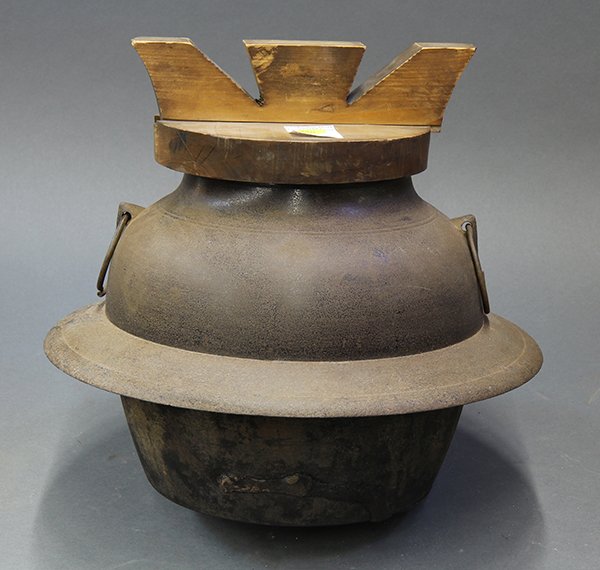 Japanese Iron Tea Kettle: Japanese iron chagama tea kettle with a wooden lid, having a bulbous body with two ring handles, approx. 9.5"h (without lid) x 13"dia