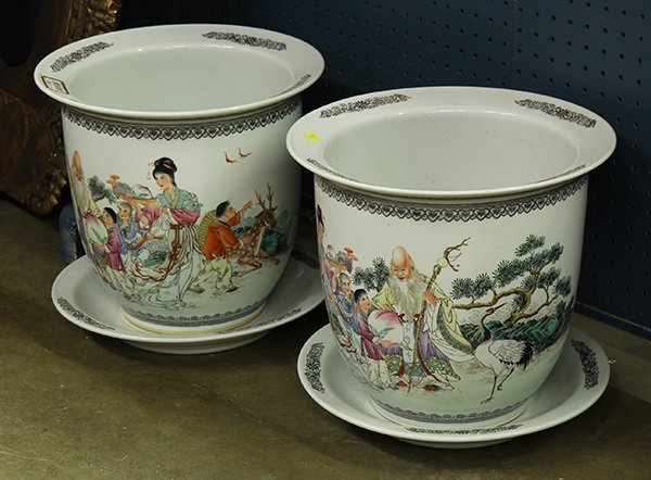 Pair of Chinese Porcelain Planters: Pair of Chinese enameled porcelain planters, decorated with cranes, pine trees, Shoulao and celestial lady serving peaches, with underdishes 14"h. Provenance: From the estate of Edward Gerber