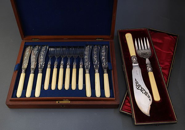 Continental silver plate fish service consisting of a: (lot of 26) Continental silver plate fish service consisting of a fish serving fork and knife by Lee & Wigfull, Sheffield, 1872-1968, resting in a red velevet lined case; together with twelve associat