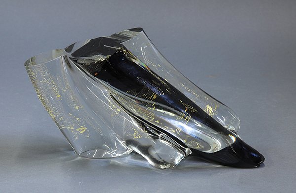 Stephen Smyers abstract art glass sculpture: Stephen Smyers abstract art glass sculpture, executed in clear and black glass with gold inclusions, suggesting a diagonal slice of a tree trunk, signed and dated 'Stephen Smyers 1991 C1103', 5"h x 10