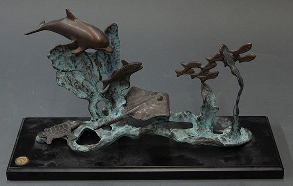 San Pacific International bronze sculpture: San Pacific International bronze sculpture, "Sea Life", depicting fish dolphins, a sting ray and a turtle, beside coral, 9"h x 14"w x 4.75"d
