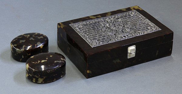 (lot of 3) Tortoise shell table articles: (lot of 3) Tortoise shell table articles, consisting of a jewlery box having a central Burmese style silvered reserve depicting a stylized figure fronting arabesque designs; together with two smaller