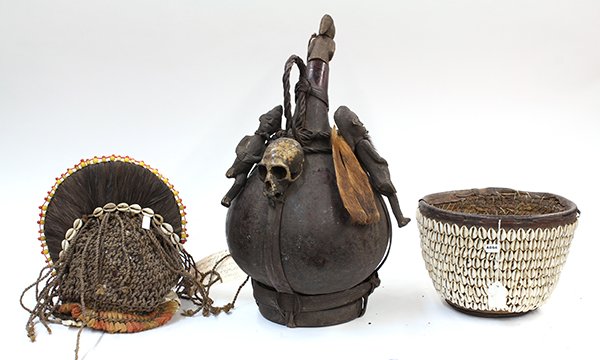 African modern decorative articles: (lot of 3) African modern decorative articles consisting of a shrine gourd with fetish mounts, cowry covered basket, and a woven head-dress, largest: 19"l