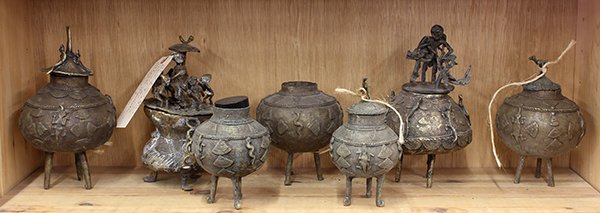 West African brass tripod containers: (lot of 7) West African brass tripod containers, two with fitted lids depicting indigenous lifestyles, largest: 9.5"h. Provenance: From the estate of Edward Gerber