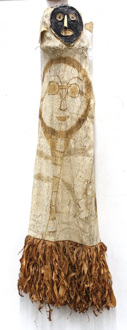 Solomon Islands and Amazon tribal traditional: (lot of 4) Tribal traditional artifacts, 1960's, including a Solomon Islands bow and arrow, together with three Amazon masks of pounded bark fiber and wood