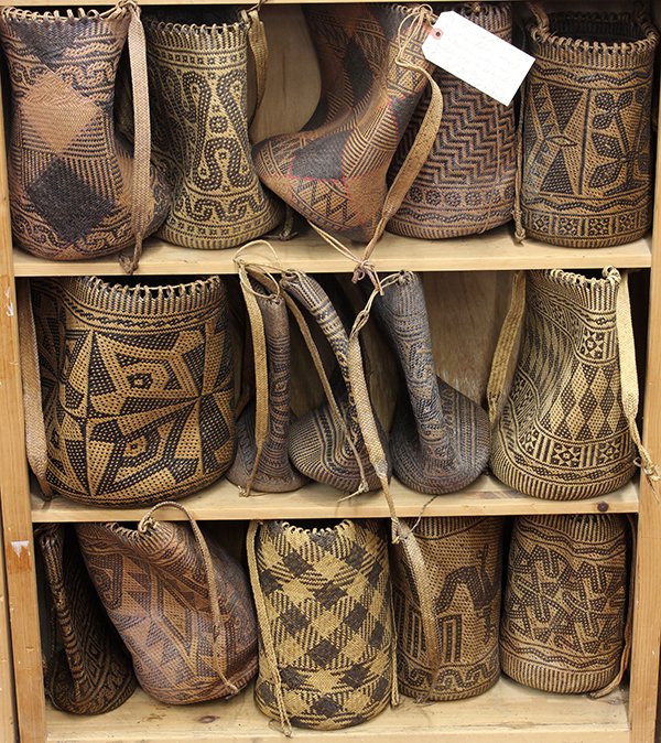 (lot of 15) Dayak of Kalimantan, Indonesia, circa: (lot of 15) Dayak of Kalimantan, Indonesia, circa 1960s-1970s, woven fiber carrying containers, worn as shoulder bags or backpacks, and with drawstring tops, all with striking abstract designs in blac