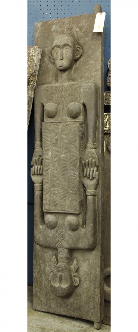 Southeast Asian carved door, the heavy decorative door: Southeast Asian carved door, the heavy decorative door featuring joined figures accented by jewelry, 82"h x 20"w. Provenance: From the estate of Edward Gerber