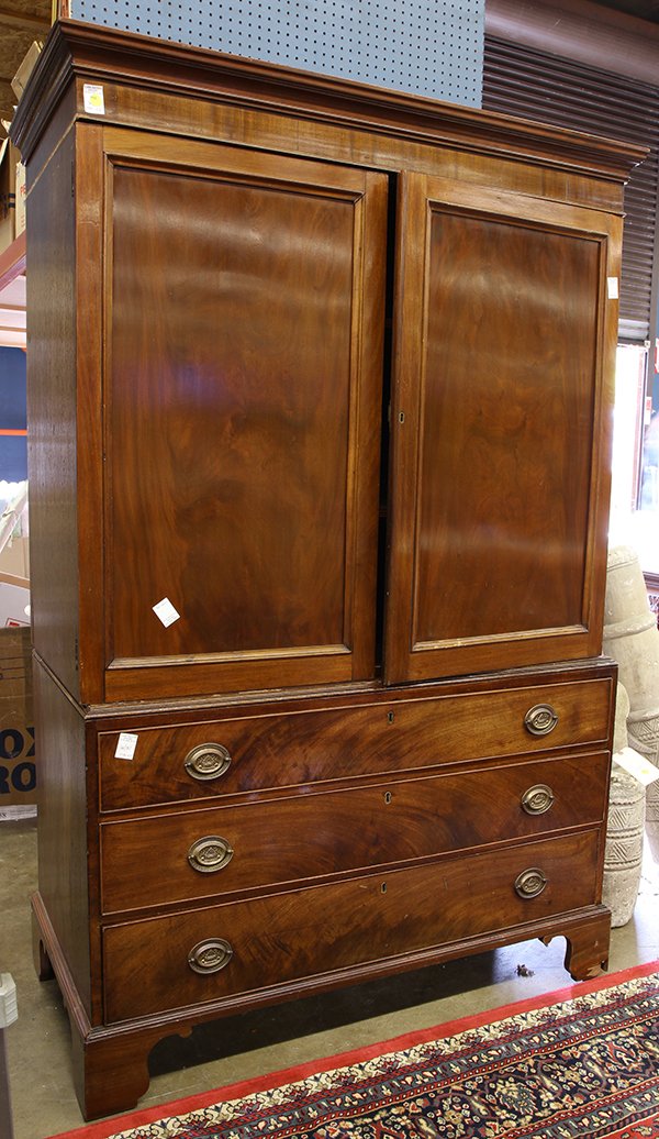 Georgian style carved walnut linen press: Georgian style carved walnut linen press, circa 1900, having a molded top above two doors opening to a fixed shelf interior, above three drawers, and rising on bracket feet 75"h x 47"w x 23.5"d