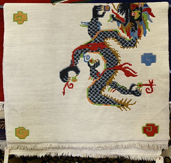 Nepalese wool carpet, having a stylized dragon design,: Nepalese wool carpet, having a stylized dragon design, 7'6" x 4'3". Provenance: From the estate of Edward Gerber