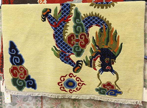 Nepalese wool carpet, having a stylized dragon design,: Nepalese wool carpet, having a stylized dragon design, 6'3" x 4'8". Provenance: From the estate of Edward Gerber