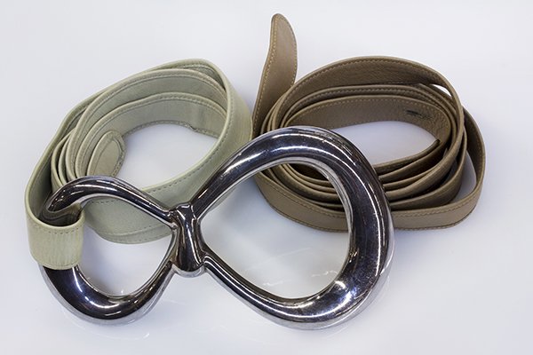 Tiffany & Co. Elsa Peretti sterling silver and leather: Tiffany & Co. Elsa Peretti sterling silver and leather belt Large buckle measures 5 1/2" X 3", with two leather belts in excellent condition, signed Tiffany & Co, Peretti Italy 1975