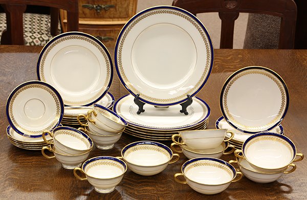 Lenox table service for six: Lenox table service for six, having a hand painted cobalt band at the rim flanked by thin gilt bands and above a leaf band on a cream ground, comprising (6) each dinner plates 10"dia, salad plates, br