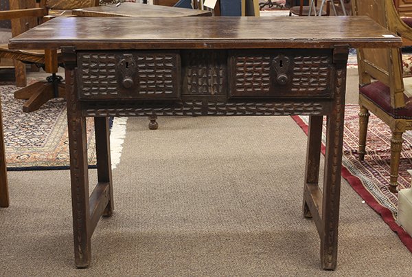 Spanish Baroque work table, 18th century, the plank top: Spanish Baroque work table, 18th century, the plank top surmounting the two drawer case, with patinated metal escutcheon, and rising on square legs, 32.5"h x 49"w x 25.5"d. Provenance: From the Collec