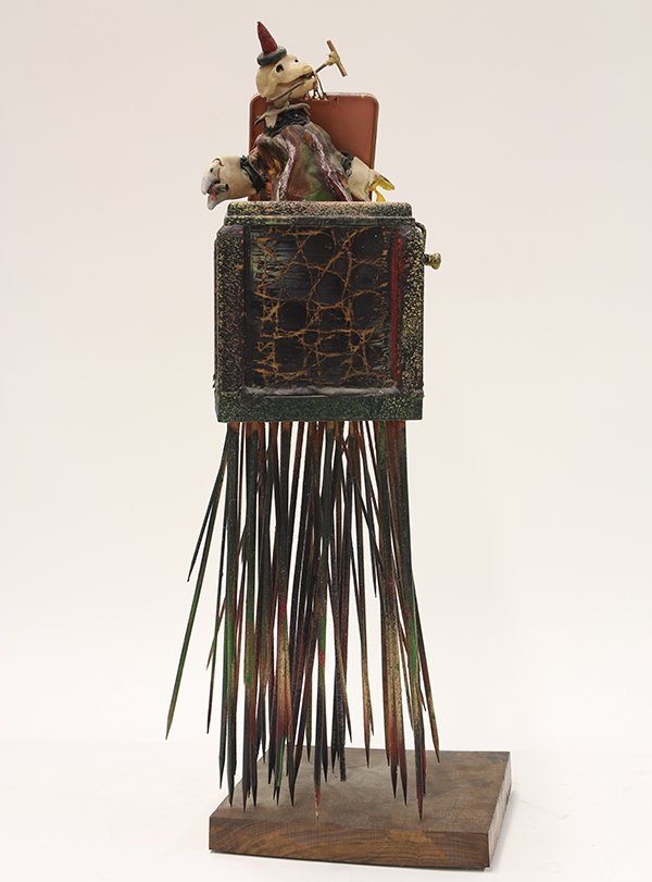 Sculpture by Richard C. Herman: Richard C. Herman (American, 20th c.), Jack in the Box of Horrors, 1998, mixed media with a jack-in-the-box, signed verso, mounted on wooden base, overall: 24"h x 9"w x 9"d. Provenance: Locus Science