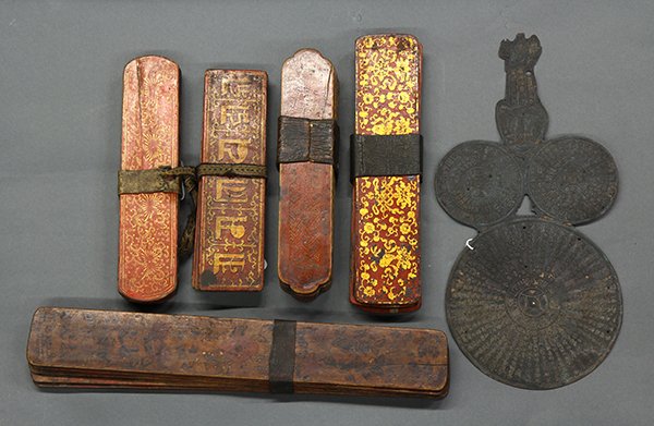 Tibetan Message Boards/Chinese Panel: (lot of 6) Five sets of Himalayan red lacquered message boards, each of the covers painted with flowers, Buddhist emblems and one with Tibetan characters; together with a Chinese metal printing panel,